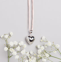 Load image into Gallery viewer, Silver plated heart Mexican bola pregnancy necklace with baby pink hand dyed silk cord