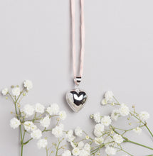 Load image into Gallery viewer, Silver plated heart Mexican bola pregnancy necklace with baby pink hand dyed silk cord
