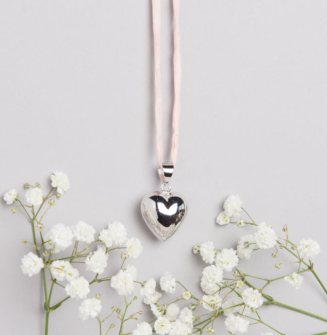 Silver plated heart Mexican bola pregnancy necklace with baby pink hand dyed silk cord