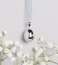 Load image into Gallery viewer, silver plated pebble shaped Mexican bola pregnancy necklace on light grey hand dyed silk cord
